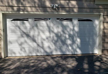 Close-up of broken torsion garage door springs in Westminster, CA home