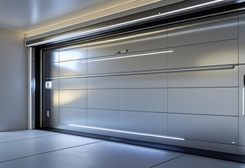 Wide-angle view of a newly installed high-tech garage door with sleek panels and integrated LED lighting in a Fountain Valley home