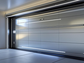 Wide-angle view of a newly installed high-tech garage door with sleek panels and integrated LED lighting in a Fountain Valley home