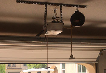 Detailed look at opener’s drive rail and wiring configuration in Fountain Valley