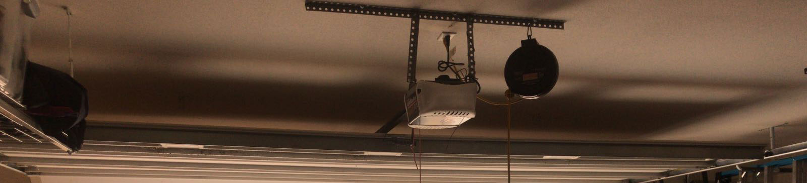 Detailed look at opener’s drive rail and wiring configuration in Fountain Valley